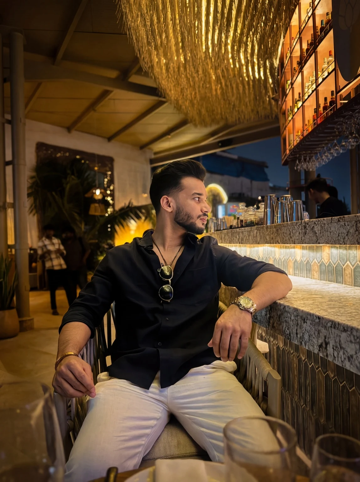 Rahul in a black shirt at an evening venue
