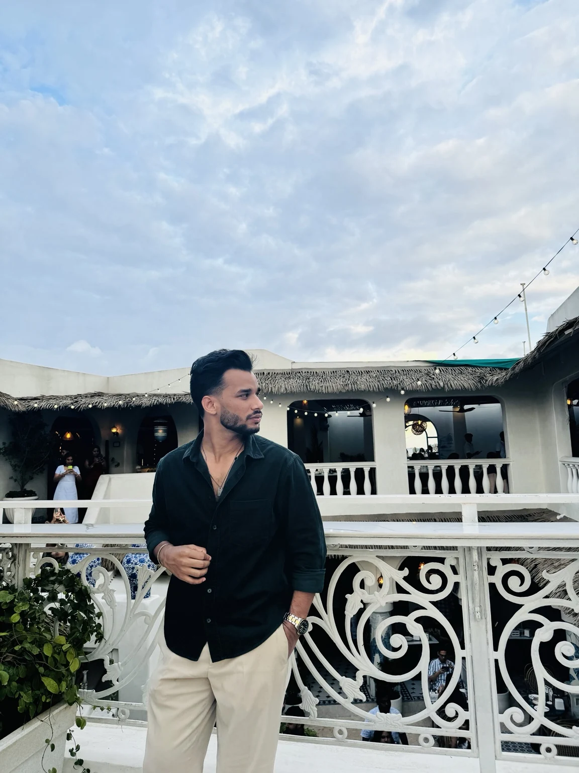 Rahul Manhar in a black shirt on a bright rooftop terrace